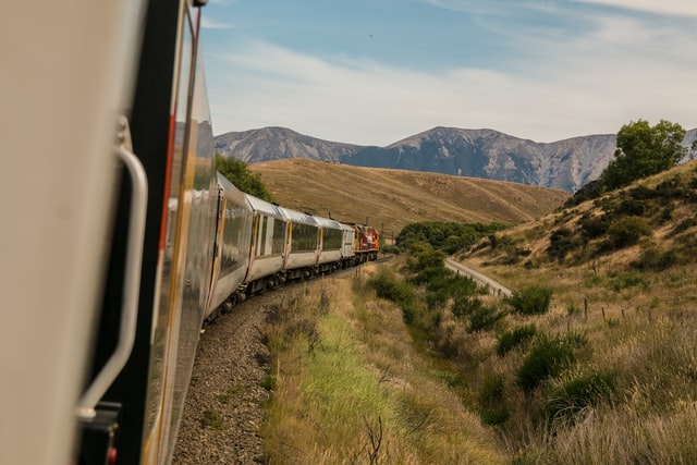 Train driving through mountains
