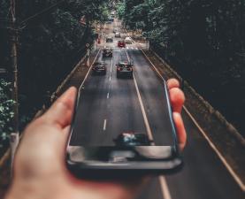 A smart phone blends into a road